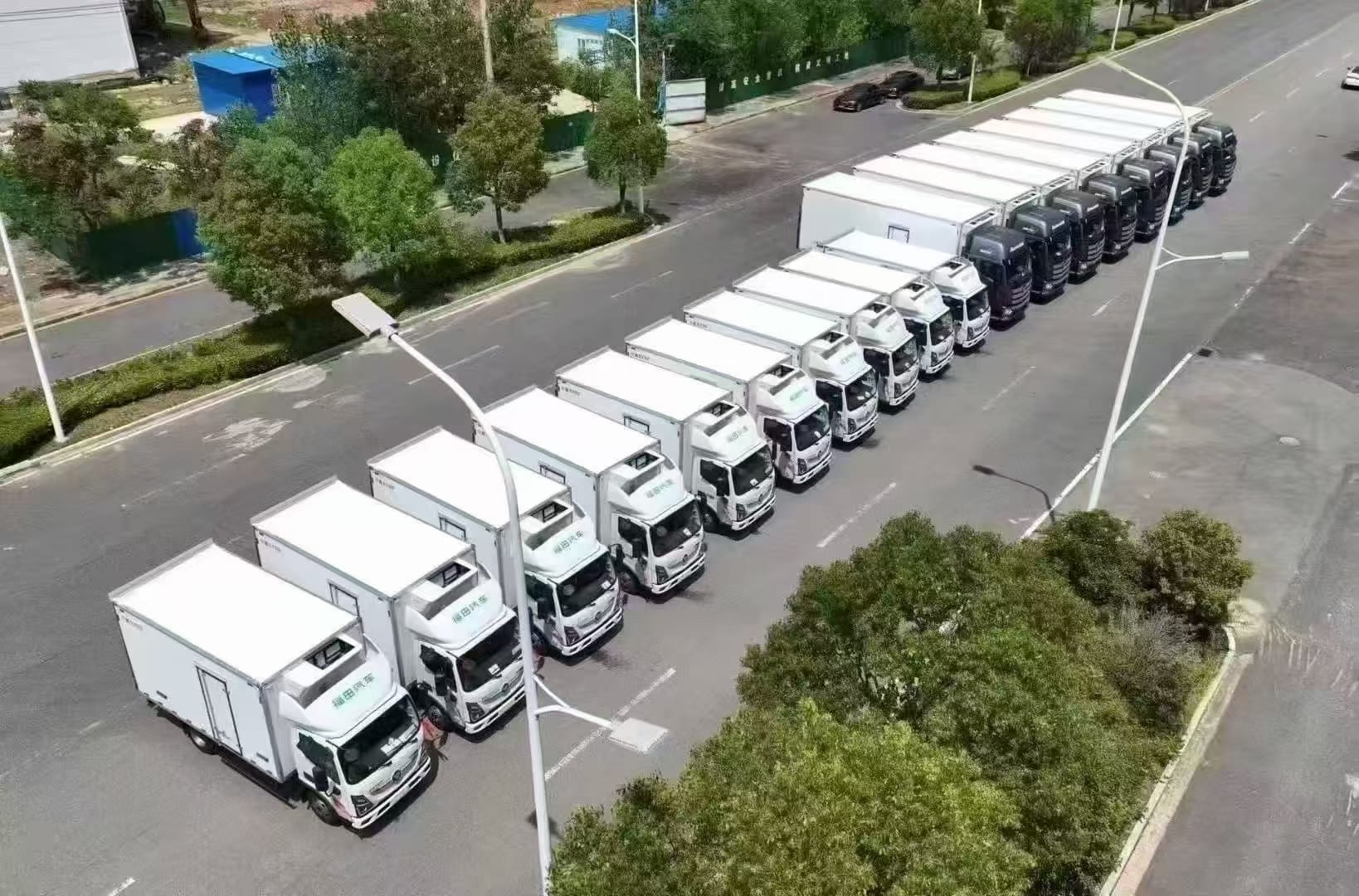 18 SPV vans are parked neatly on the road