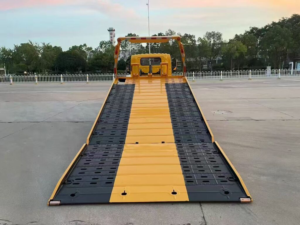 A high-quality photo of your Isuzu or Dongfeng Flatbed Tow Truck in action